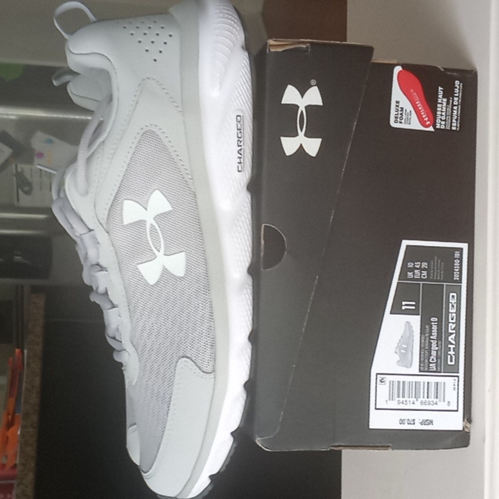Mens Under Armour Charged Assert 9's.Size 11 Grey in color.